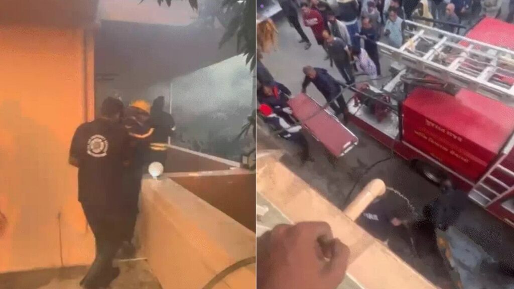 घर में फैली आग को बुझाते फायर कर्मी।