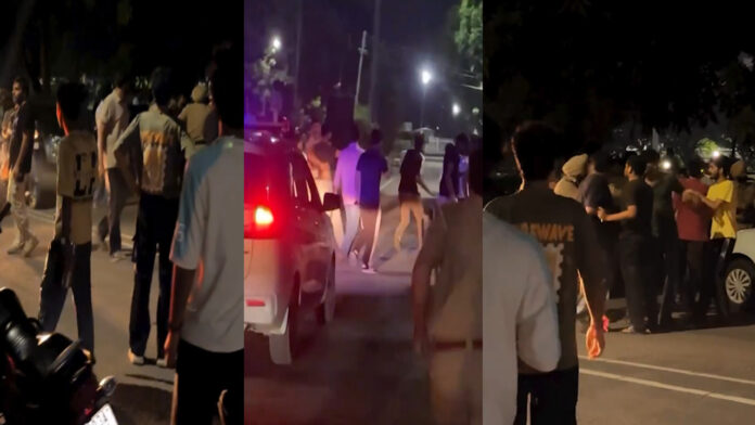 PU में 2 पक्षों में झड़प, पुलिस-सिक्योरिटी के सामने जमकर चले लात-घूंसे, देखें वीडियो